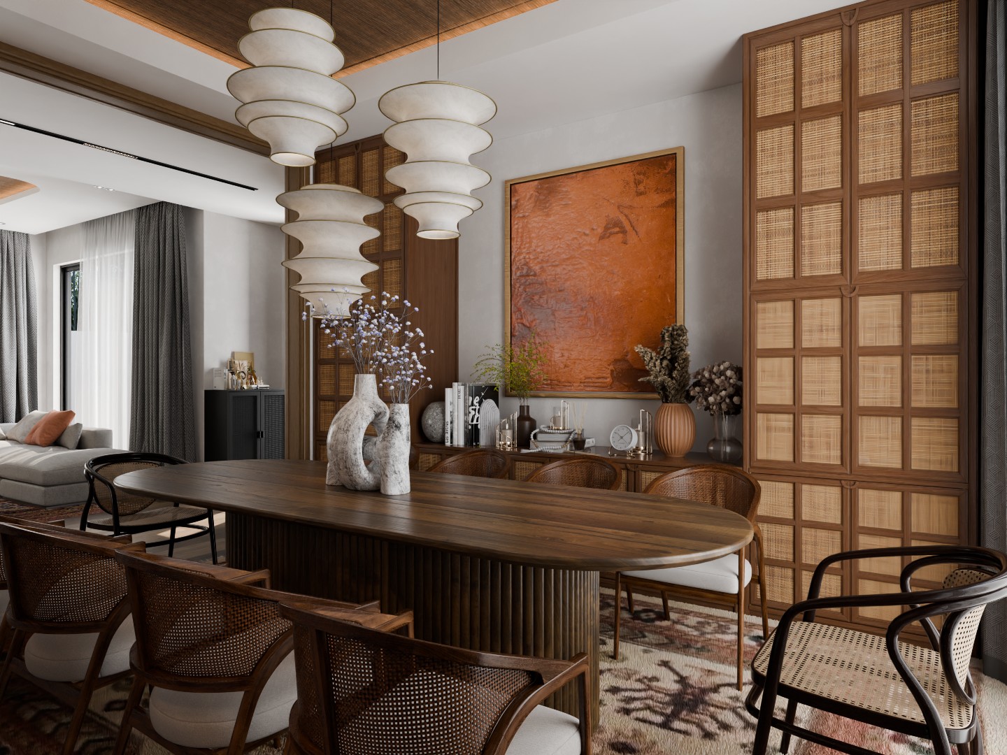 Stacked paper pendants over the oval table